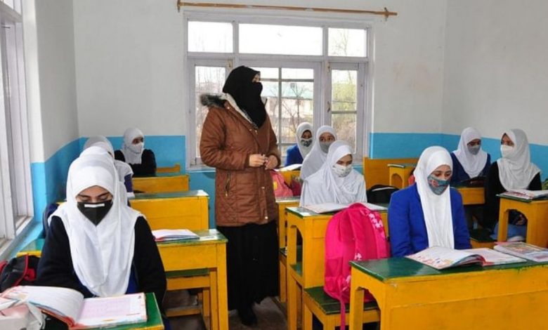 A private school teacher in Kashmir taking his class