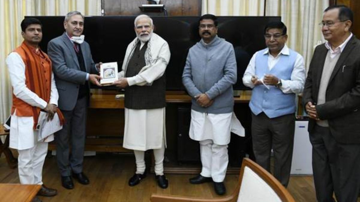 Shri Dharmendra Pradhan presents a book titled India: The Mother of Democracy to the Prime Minister Shri Narendra Modi